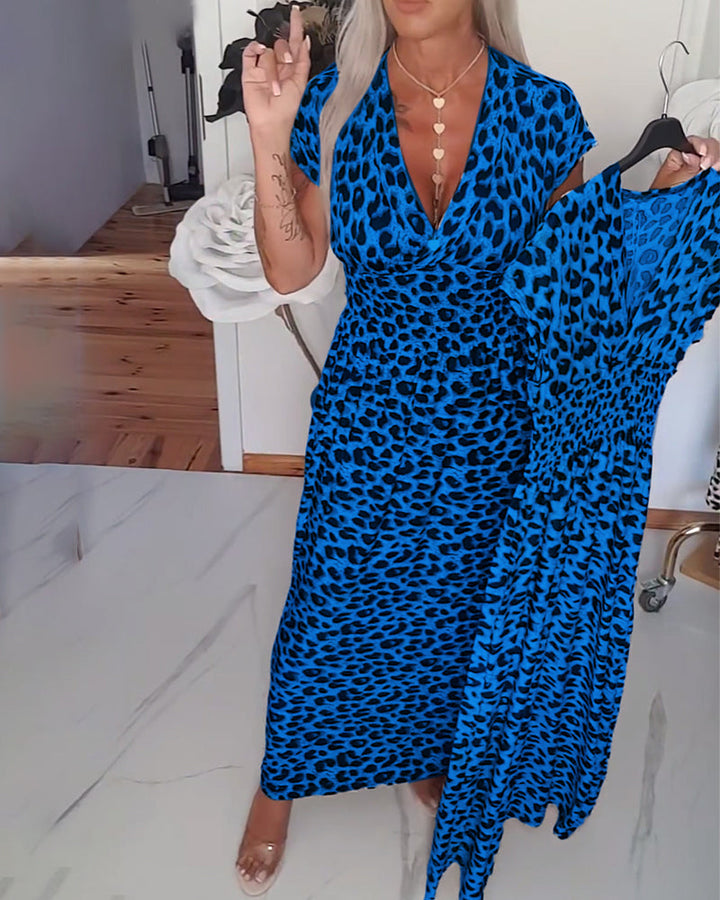 Elegant dress with leopard print and V-neck.