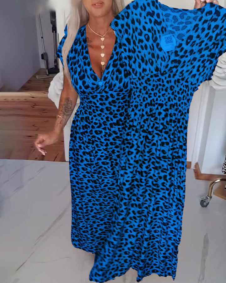 Elegant dress with leopard print and V-neck.